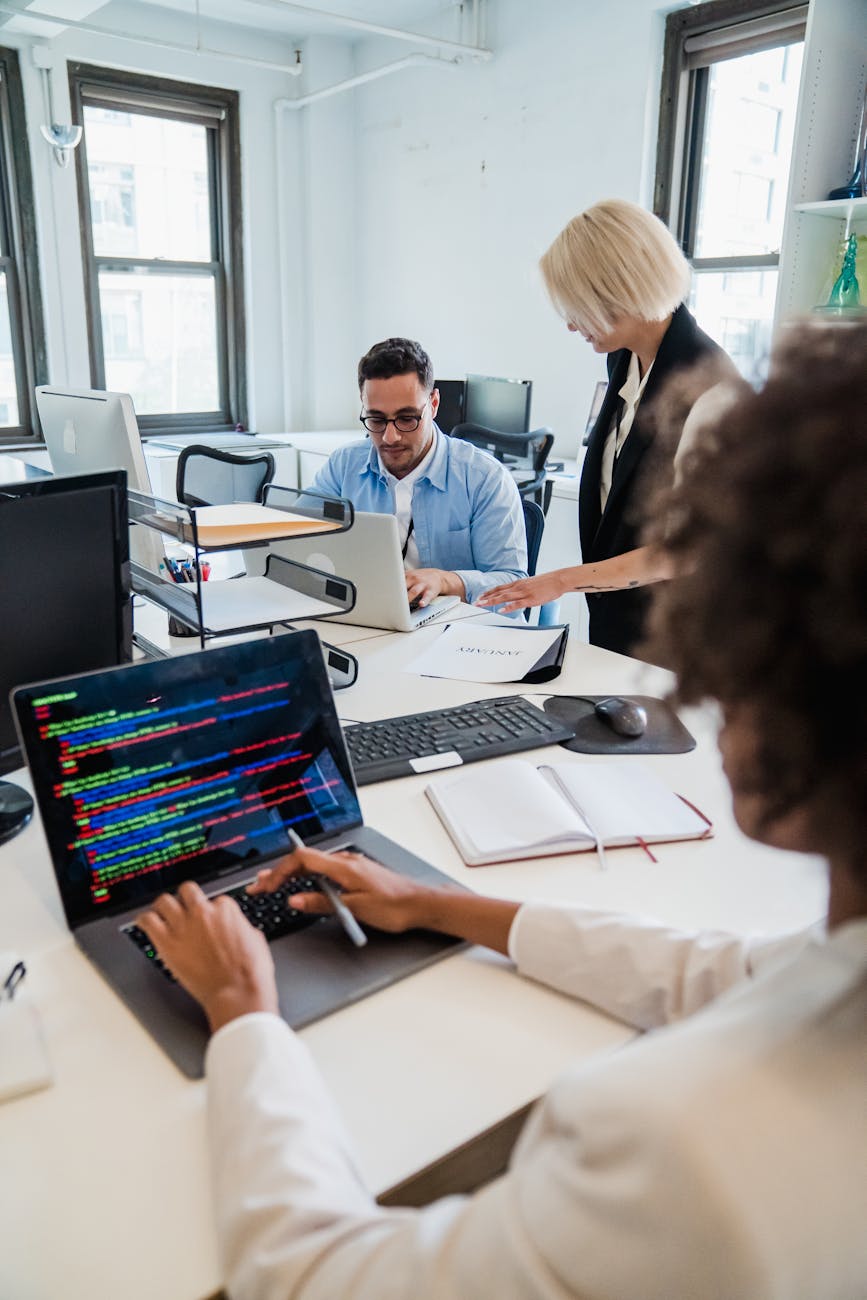 three people working at office