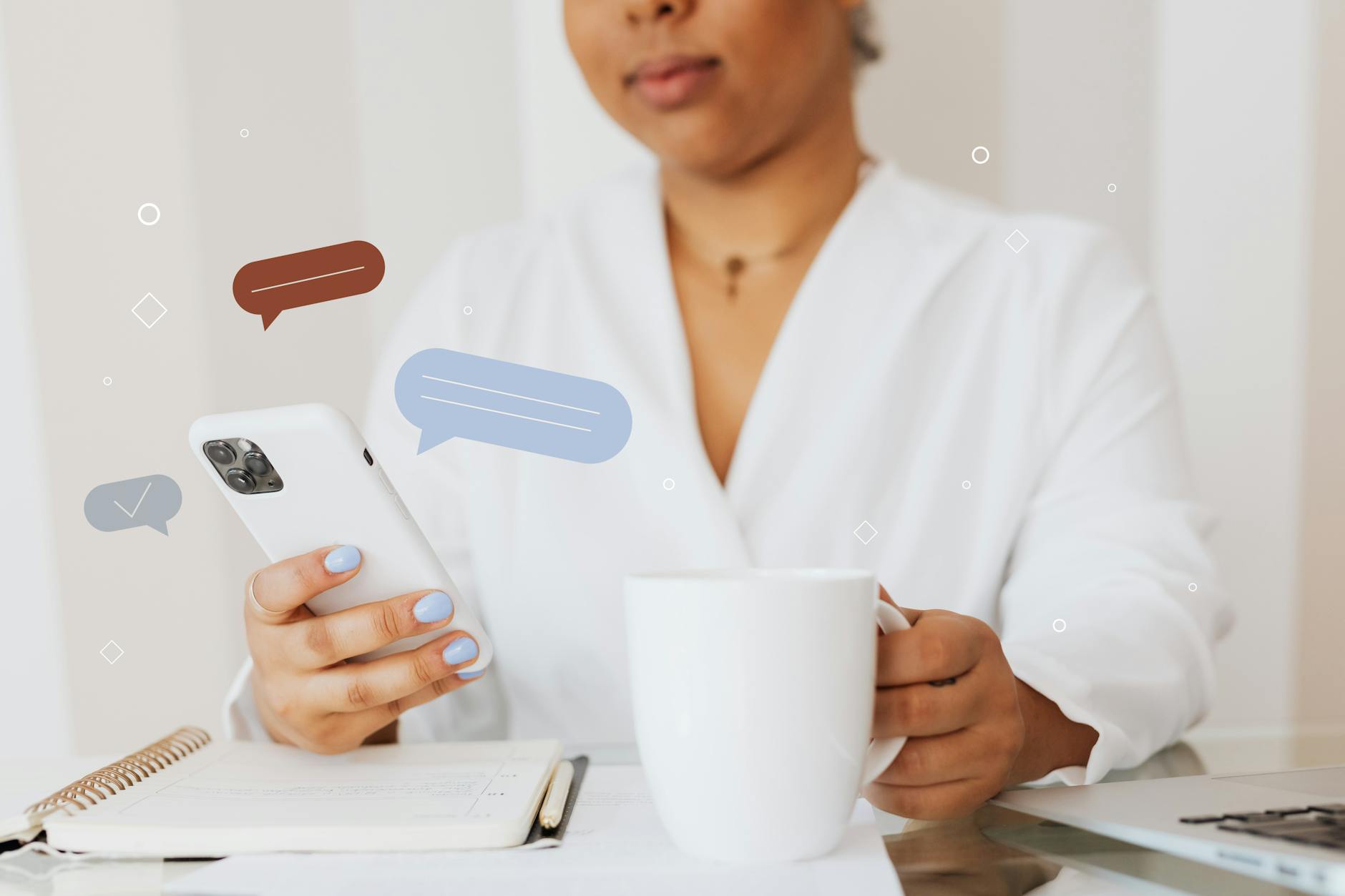 close up shot of a person using a smartphone while holding a cup of coffee