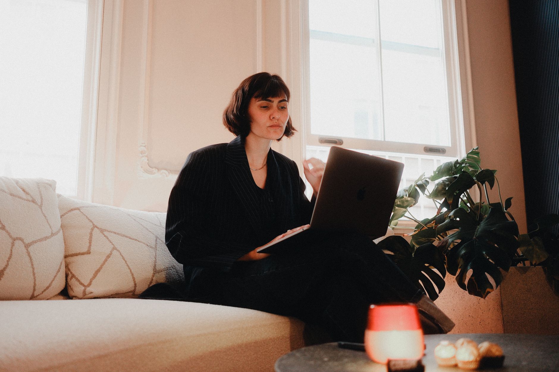 young professional working on laptop at home
