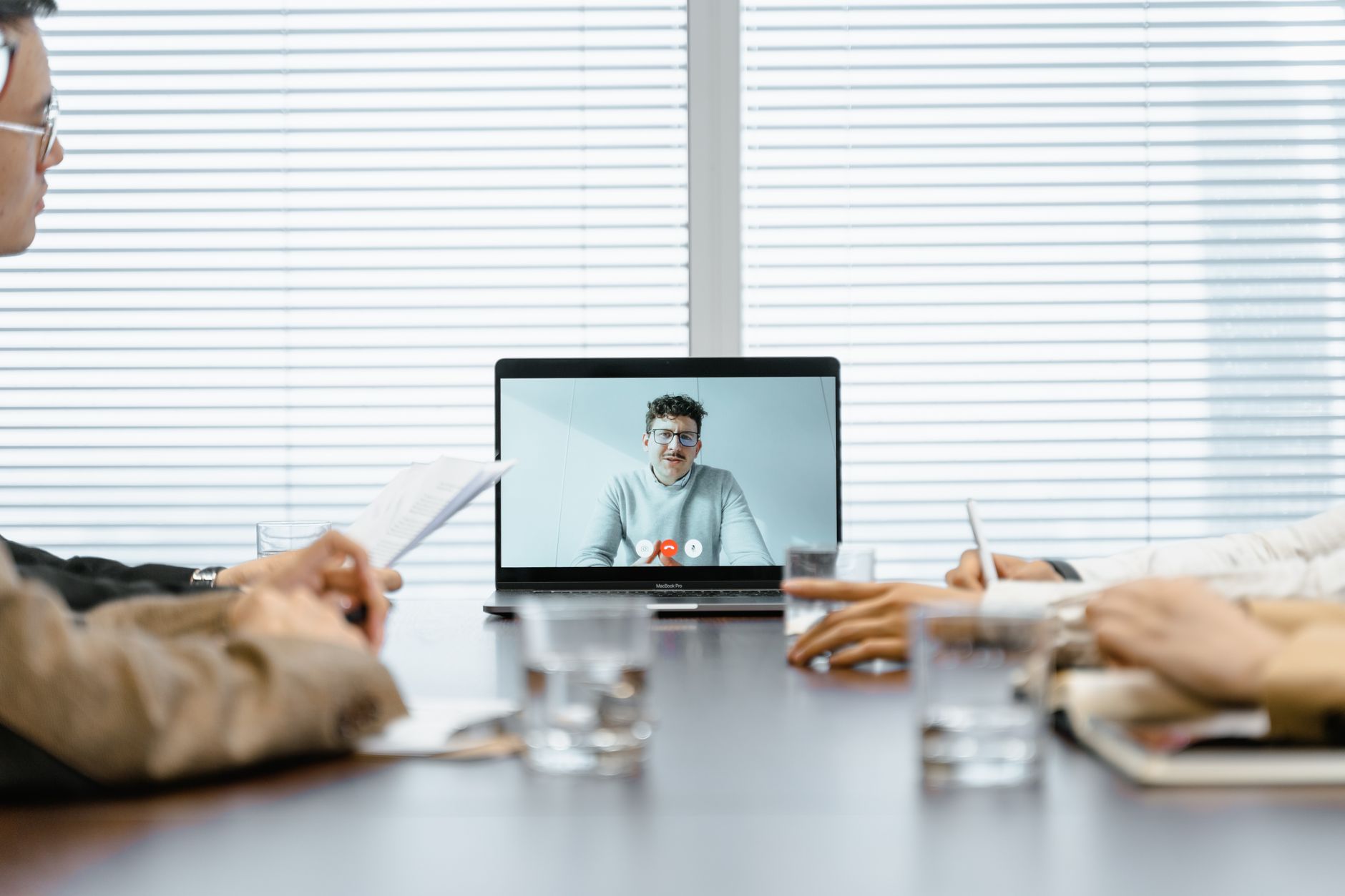 a man conducting a meeting virtually